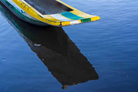 Canoes and boats docked on the Jaguaripe River in Maragogipinho, Aratuipe city in Bahia, Brazil.