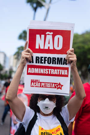 Salvador, Bahia, Brazil - October 02, 2021: Brazilians protest with banners and posters against the government of President Jair Bolsonaro in the city of Salvador.のeditorial素材