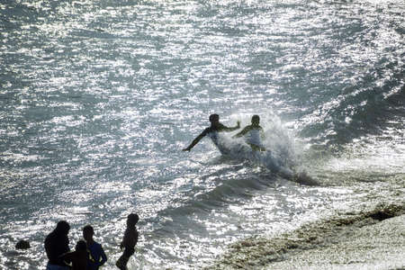 Salvador, Bahia, Brazil - November 01, 2021: People at PaciÃªncia beach in Salvador having fun...