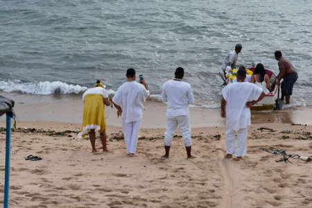 Salvador, Bahia, Brazil - May 21, 2022: Candomble members delivering gifts to Iemanja, the queen of...