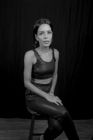 Portrait of a woman against black background. Salvador, Bahia, Brazil.の写真素材