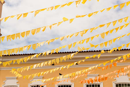 Colorful flags decorating the feast of Sao Joao in Pelourinho, Historic Center of Salvador, Bahia.の写真素材