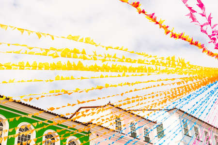 Colorful flags decorating the feast of Sao Joao in Pelourinho, Historic Center of Salvador, Bahia.の写真素材