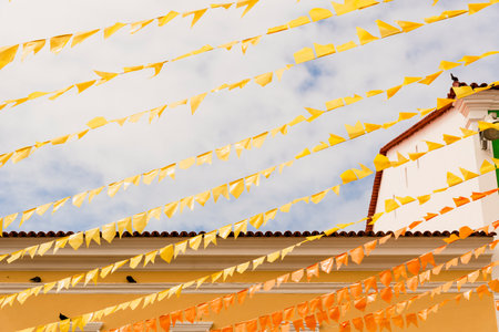 Colorful flags decorating the feast of Sao Joao in Pelourinho, Historic Center of Salvador, Bahia.の写真素材