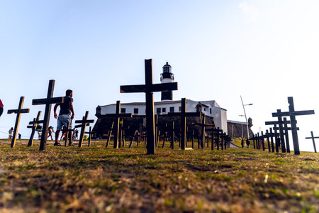 Salvador, Bahia, Brazil - October 01, 2021: Crosses fixed to the ground in honor of those killed by Covid-19 at Farol da Barra in Salvador, Bahia, Brazil.のeditorial素材