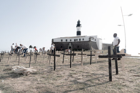 Salvador, Bahia, Brazil - October 01, 2021: Crosses fixed to the ground in honor of those killed by Covid-19 at Farol da Barra in Salvador, Bahia, Brazil.のeditorial素材