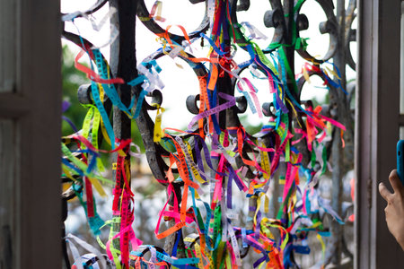 Colored ribbons attached to the iron grid. Salvador, Bahia, Brazil.のeditorial素材