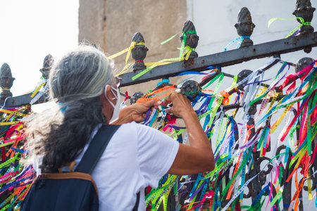 Salvador, Bahia, Brazil - January 07, 2022: Faithful gathered at the famous Senhor do Bonfim church in Salvador, Bahia, praying for a new year.のeditorial素材