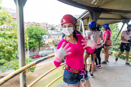 Salvador, Bahia, Brazil - October 24, 2021: Group of Rappelists getting ready to go down the walkway. City of Salvador capital of Bahia, Brazil.のeditorial素材