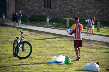 Salvador, Bahia, Brazil - May 21, 2021: People having fun on a grass floor in Barra neighborhood in Salvador, Bahia.のeditorial素材