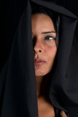 Portrait of a woman wearing hijab against black background. Salvador, Bahia, Brazil.の写真素材