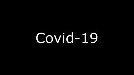 Inscription COVID-19 on black background. The World Health Organization WHO has introduced a new official name for the Coronavirus disease called COVID-19の写真素材
