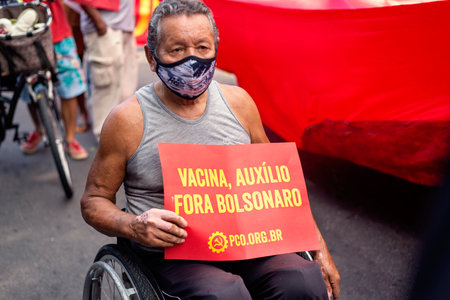 Salvador, Bahia, Brazil - October 02, 2021: People protesting with banners, posters and screams at the event against the government of President Bolsonaro, in Salvador, Bahia.のeditorial素材