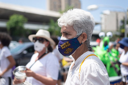 Salvador, Bahia, Brazil - October 02, 2021: People protesting with banners, posters and screams at the event against the government of President Bolsonaro, in Salvador, Bahia.のeditorial素材