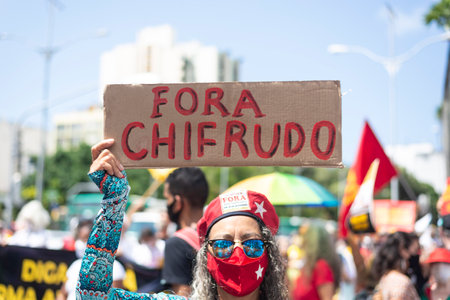 Salvador, Bahia, Brazil - October 02, 2021: People protesting with banners, posters and screams at the event against the government of President Bolsonaro, in Salvador, Bahia.のeditorial素材