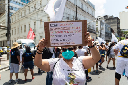 Salvador, Bahia, Brazil - October 02, 2021: People protesting with banners, posters and screams at the event against the government of President Bolsonaro, in Salvador, Bahia.のeditorial素材