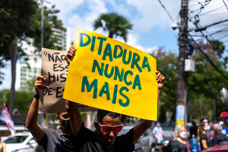 Salvador, Bahia, Brazil - October 02, 2021: People protesting with banners, posters and screams at the event against the government of President Bolsonaro, in Salvador, Bahia.のeditorial素材