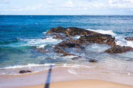 View of the sea breaking on the beach. Salvador, Bahia, Brazil.の写真素材