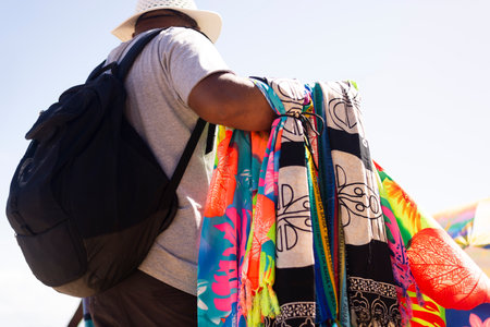 Salvador, Bahia, Brazil - June 04, 2022: Street vendors walk on the sand of Porto da Barra beach in Salvador, Bahia.のeditorial素材