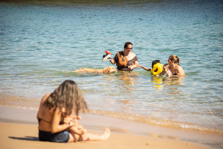 Salvador, Bahia, Brazil - June 04, 2022: People having fun on the beach at Porto da Barra in Salvador, Bahia State, Brazil.のeditorial素材