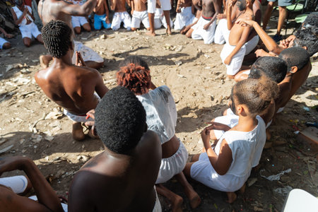 Santo Amaro, Bahia, Brazil - July 24, 2022: Members of the cultural event Nego Fugido dance and sing in a group for the end of slavery in Acupe, Santo Amaro, Bahia.のeditorial素材