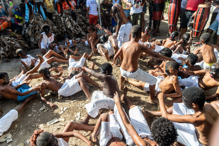Santo Amaro, Bahia, Brazil - July 24, 2022: Members of the cultural manifestation Nego Fugido lying on the ground for the end of slavery in Acupe, Santo Amaro, Bahia.のeditorial素材