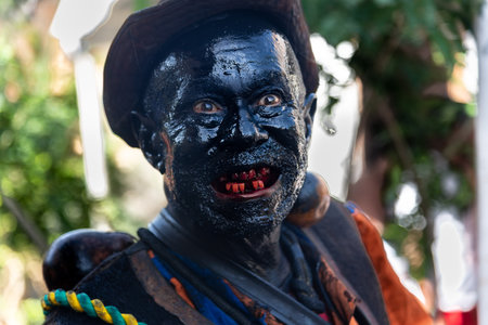 Santo Amaro, Bahia, Brazil - July 24, 2022: Members of the cultural event Nego Fugido show their mouth with blood for a performance in Acupe, Santo Amaro, Bahia.のeditorial素材