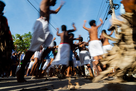 Santo Amaro, Bahia, Brazil - July 24, 2022: Members of the cultural event Nego Fugido move, dance and sing for the end of slavery in Acupe, Santo Amaro, Bahia.のeditorial素材