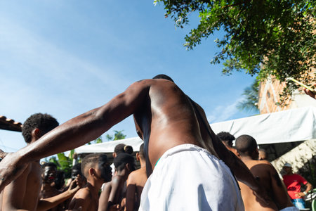 Santo Amaro, Bahia, Brazil - July 24, 2022: Members of the cultural event Nego Fugido dance and sing in a group for the end of slavery in Acupe, Santo Amaro, Bahia.のeditorial素材