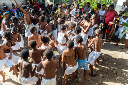 Santo Amaro, Bahia, Brazil - July 24, 2022: Members of the cultural event Nego Fugido dance and sing in a group for the end of slavery in Acupe, Santo Amaro, Bahia.のeditorial素材