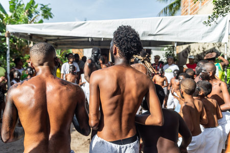 Santo Amaro, Bahia, Brazil - July 24, 2022: Members of the cultural event Nego Fugido dance and sing in a group for the end of slavery in Acupe, Santo Amaro, Bahia.のeditorial素材