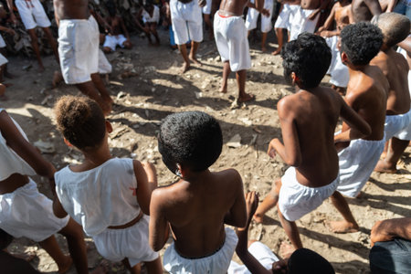 Santo Amaro, Bahia, Brazil - July 24, 2022: Members of the cultural event Nego Fugido dance and sing in a group for the end of slavery in Acupe, Santo Amaro, Bahia.のeditorial素材