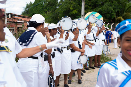 Saubara, Bahia, Brazil - August 03, 2019: Men, women and children, members of the cultural group CheganÃ§a dos Marujos, dance and sing in costumes during a performance at the streets of Saubara, Bahia.のeditorial素材