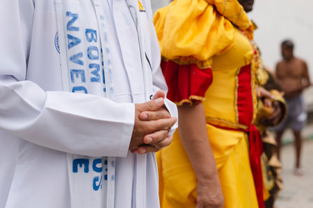 Saubara, Bahia, Brazil - August 03, 2019: Men, women and children, members of the cultural group CheganÃ§a dos Marujos, dance and sing in costumes during a performance at the streets of Saubara, Bahia.のeditorial素材