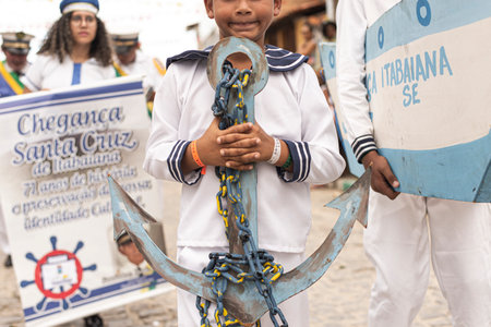 Saubara, Bahia, Brazil - August 03, 2019: Men, women and children, members of the cultural group CheganÃ§a dos Marujos, dance and sing in costumes during a performance at the streets of Saubara, Bahia.のeditorial素材