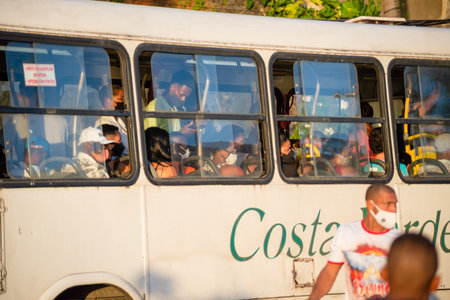 Salvador, Bahia, Brazil - November 01, 2021: People inside the bus wearing protective mask against covid-19 on the streets of Salvador, Bahia.のeditorial素材