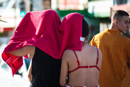 Salvador, Bahia, Brazil - November 01, 2021: People walking on the street of Rio Vermelho beach in...