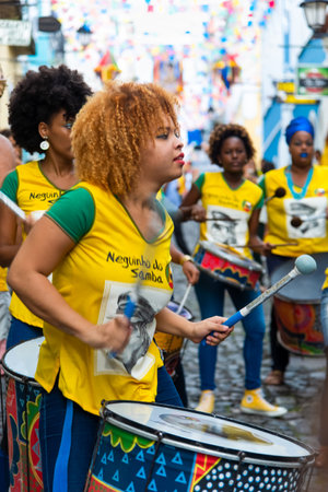 Salvador, Bahia, Brazil - June 22, 2018: Dida Band members play percussion instruments at Pelourinho...