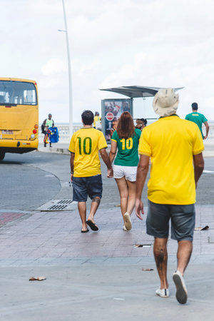 Salvador, Bahia, Brazil - June 22, 2018: Fans of Brazil walk in the streets of Barra in Salvador, before the match between Brazil versus Costa Rica for the soccer world cup in Russia in 2018.のeditorial素材