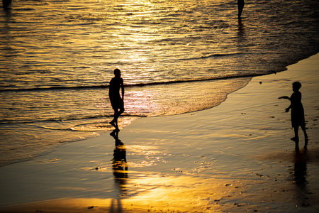 Salvador, Bahia, Brazil - November 01, 2021: Young people playing frescoboll against sunset at Rio Vermelho beach in Salvador, Bahia.のeditorial素材