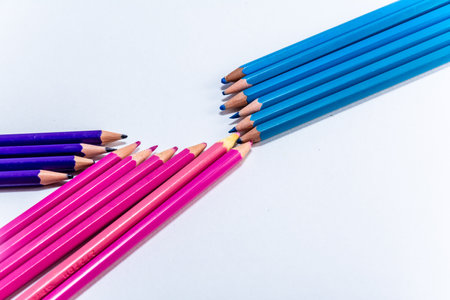 Pink blue and lilac wooden pencils isolated on white background. close up