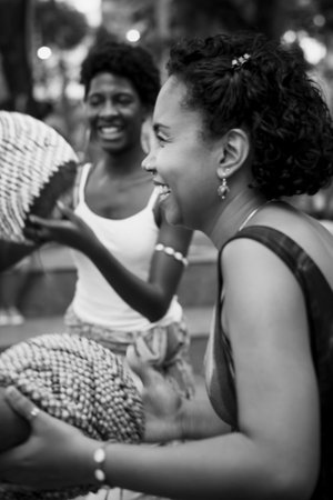 Salvador, Bahia, Brazil - September 17, 2016: Women playing Abe or Xequere, percussion musical...