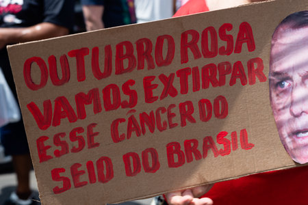 Salvador, Bahia, Brazil - October 02, 2021: Protester carries a poster during a demonstration...