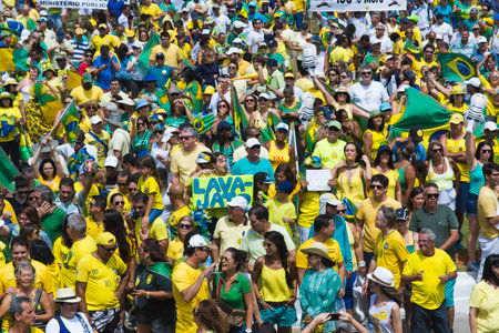 Salvador, Bahia, Brazil - March 13, 2016: Brazilians protesting against the government of President Dilma Rousseff, Brazil, at Farol da Barra.のeditorial素材