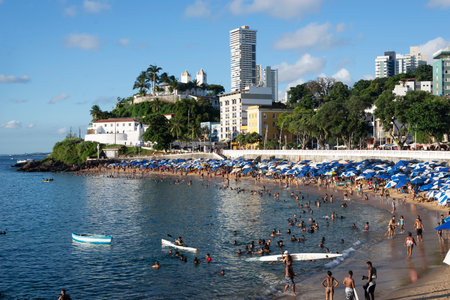 Salvador, Bahia, Brazil - April 09, 2022: Brazilians and tourists bathe at Porto da Barra beach in Salvador on a sunny afternoon.のeditorial素材
