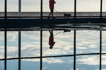 Salvador, Bahia, Brazil - December 05, 2021: People practicing physical exercises in the Rio Vermelho neighborhood in Salvador, Bahia, in the late afternoon.のeditorial素材