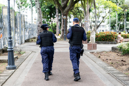 Salvador, Bahia, Brazil - October 29, 2022: Two municipal guards patrolling the streets of Campo Grande square. Salvador city.のeditorial素材
