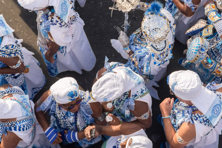 Salvador, Bahia, Brazil - February 11, 2018: Members of the traditional carnival block Filhos de Gandy parade in Castro Alves square during Carnival in Salvador, Bahia.のeditorial素材
