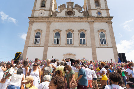 Salvador, Bahia, Brazil - January 06, 2023: Crowd of Catholics in front of Senhor do Bonfim church during mass. City of Salvador, Bahia.のeditorial素材
