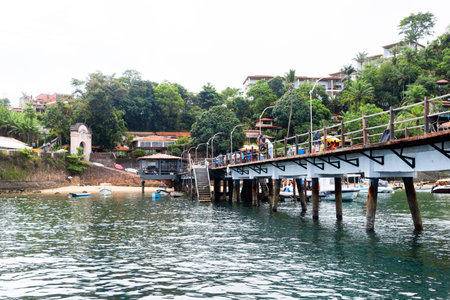 Cairu, Bahia, Brazil - January 19, 2023: People walking on the maritime pier of Morro de Sao Paulo, in the city of Cairu.のeditorial素材